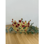 Gold floral crown with red bead roses and green leaves