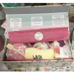 Gift box with bath products, soap bars, and a washcloth