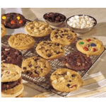 Assorted cookies cooling on wire racks and in bowls