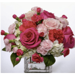 Pink and white roses with carnations in a clear glass vase