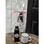 Gift set with coffee mugs and a bottle of coffee in clear wrap