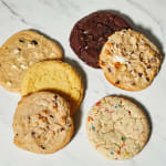 Assorted cookies on a white marble surface
