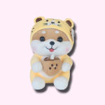 Plush bear in a yellow animal hood holding a cup