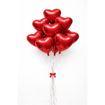 Cluster of red heart-shaped balloons tied with silver ribbons