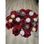 Red rose bouquet with Ferrero Rocher chocolates nestled among the blooms