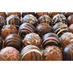 Assorted chocolate truffles with drizzled and sprinkled toppings
