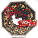 Seed-covered wreath with a red bow in a box