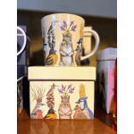 Decorative mug and box with illustrated birds and a squirrel