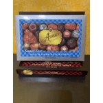 Stacked boxes of assorted chocolates on a table