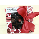 Box of assorted chocolates tied with a red ribbon