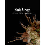 Logo on black background with a floral arrangement in the corner