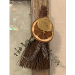 Dried botanical bundle with a sliced orange and gold ornament