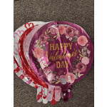 Stack of round foil balloons with Valentine’s Day floral designs