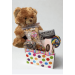 Teddy bear gift basket with candy, chocolate, and a lollipop