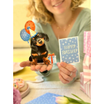 Birthday card with a dachshund holding balloons