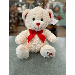 White teddy bear with a red bow and heart details
