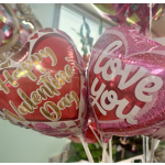 Heart-shaped Valentine balloons with "Happy Valentine Day" and "Love" text