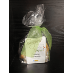 Bag of creamy caramels tied with a green ribbon