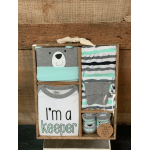 Baby clothing gift set in a box with a bear bodysuit and socks