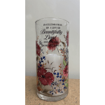 Glass memorial candle holder with floral print and a white candle inside