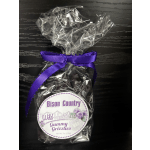 Bag of wild huckleberry gummy candies tied with a purple ribbon