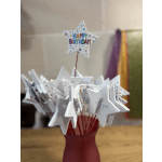 Star-shaped birthday picks in a red vase