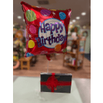 Birthday balloon with a box of chocolates tied below it