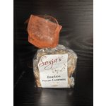 Bag of bourbon pecan caramels tied with orange ribbon