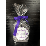 Bag of sour gummy grizzlies tied with a purple ribbon