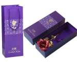 Purple gift box with a preserved red rose and gold stem