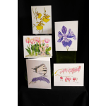 Five botanical art prints displayed on easels against a black background.