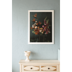 Framed floral arrangement artwork with orange and pink flowers on a dark background