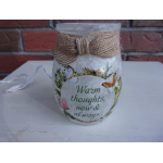 Decorative glass jar with a twine bow and "Warm thoughts, now & always" text
