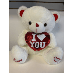 White teddy bear holding a red sequin heart with "I ♥ YOU"