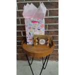 Gift bag with pink tissue paper and Ferrero Rocher chocolates