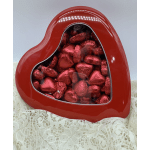Red heart-shaped box filled with foil-wrapped chocolates
