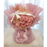 Pink rose bouquet with a crown and butterfly decorations