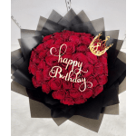 Red rose bouquet with a gold "Happy Birthday" topper and crown