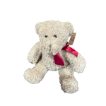 Cream teddy bear with a red ribbon bow