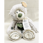 Plush gray teddy bear with a prayer tag and stitched paws