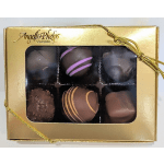 Gold gift box of assorted chocolates with clear window and gold cord bow