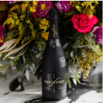 Black Freixenet bottle in front of a colorful rose bouquet