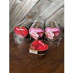 Heart-shaped boxes of Russell Stover chocolates on a wooden table