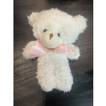 White plush teddy bear with a pink ribbon bow