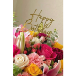Colorful bouquet with roses, lilies, and carnations with a "Happy Birthday" sign