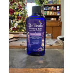Blue bottle of Dr Teal's foaming bath on a table