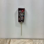 M&M's chocolate candy package on a wooden stick