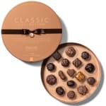 Round box of assorted chocolates with a ribbon and lid