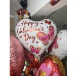 Heart-shaped Valentine’s Day balloons with butterfly designs