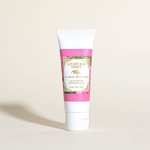 Pink and white tube of glycerine hand therapy lotion on a light background